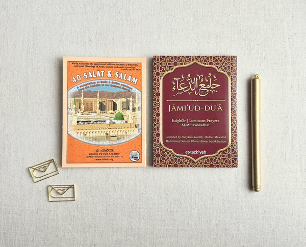 Close-up of 40 Salat and Salam and Jami'ud-Du'a booklets by Shaykh Muhammad Saleem Dhorat — Istighfar, Luminous Prayers and Al-Mu'awwadhat, published by Islamic Da'wah Academy