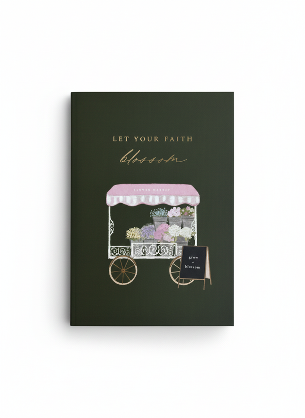A vertical shot of a khaki green A5 notebook. The cover features gold foil text that reads "Let Your Faith Blossom" above a detailed illustration of a flower market cart. The book is resting on a white background.