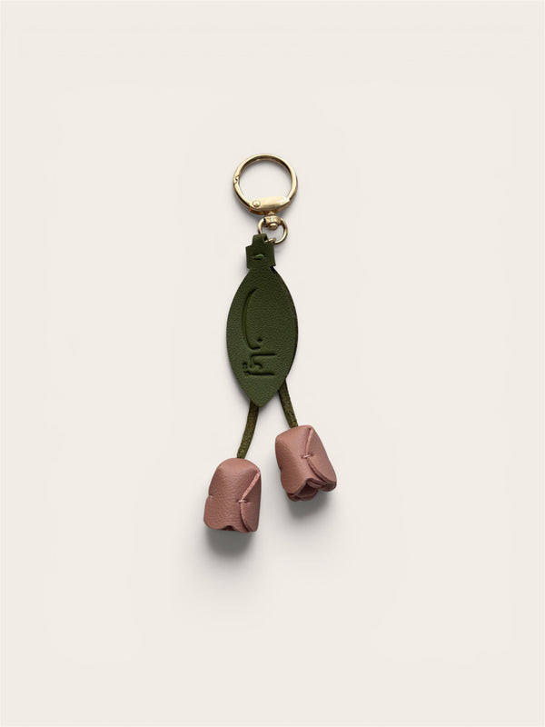 Iman keychain with two dusty pink tulip buds and sage green leaf Arabic calligraphy