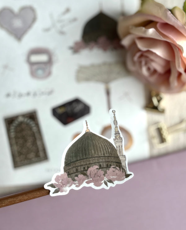 A close up of the green dome floral sticker with sticker sheet blurred in background